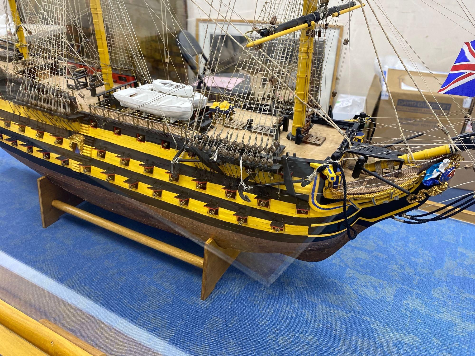 A model of the HMS Victory in perspex case, approximate length 120cm